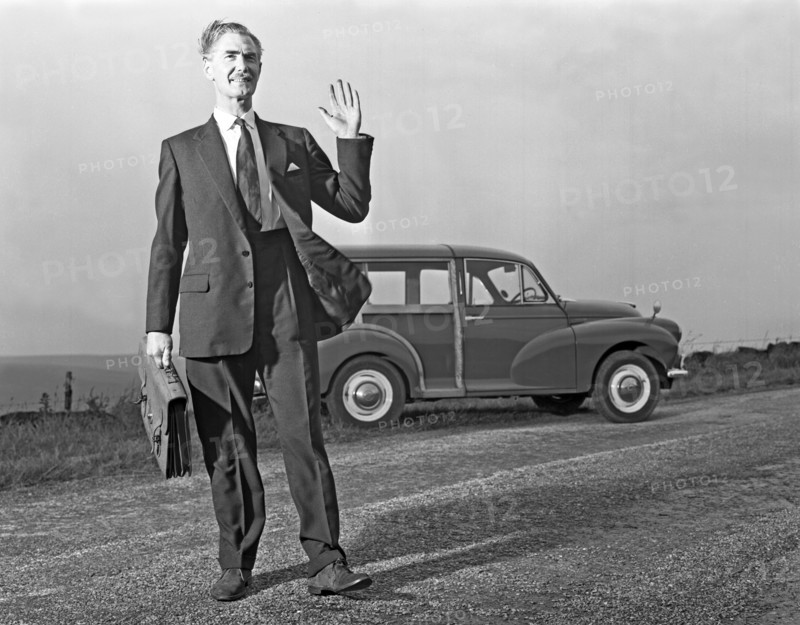 Waving Sales rep with a Moris Minor Shooting Brake, 3rd Aug 1963. Artist: Michael Walters