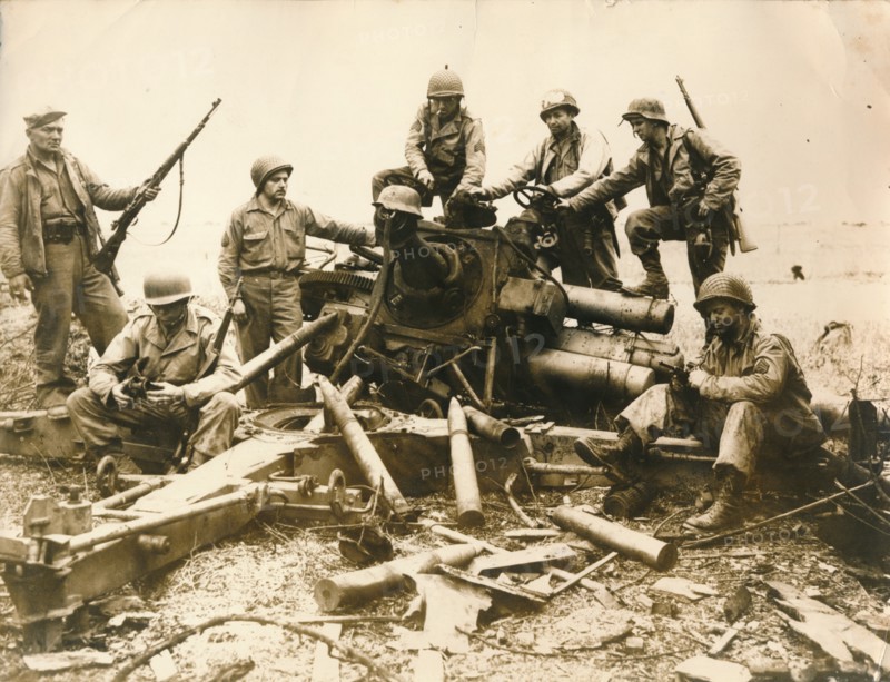 American troops looking for souvenir near Cherbourg airport, July 1944. Artist: Unknown