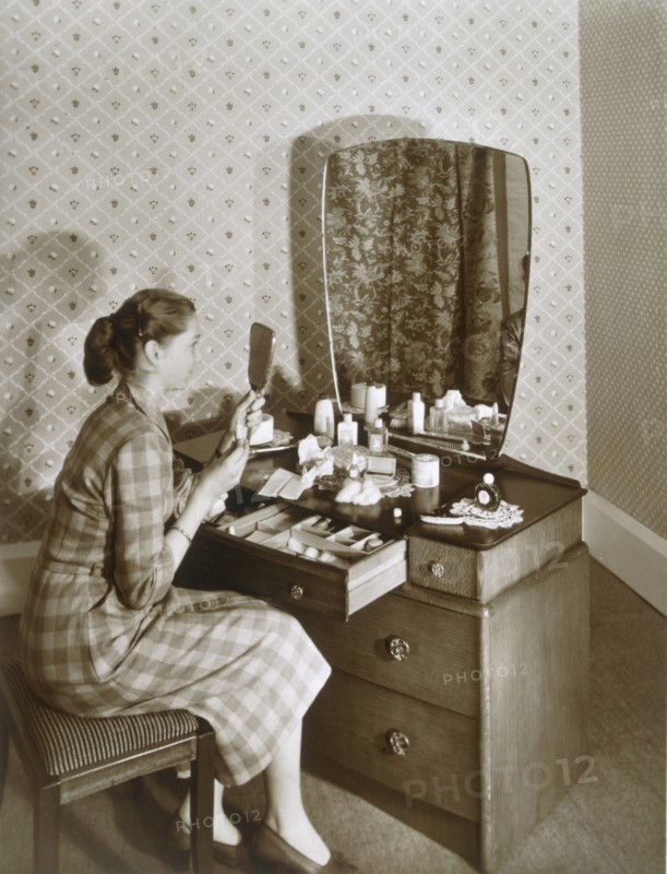 Woman at her dressing table, c1955. Creator: English Photographer (20th Century).