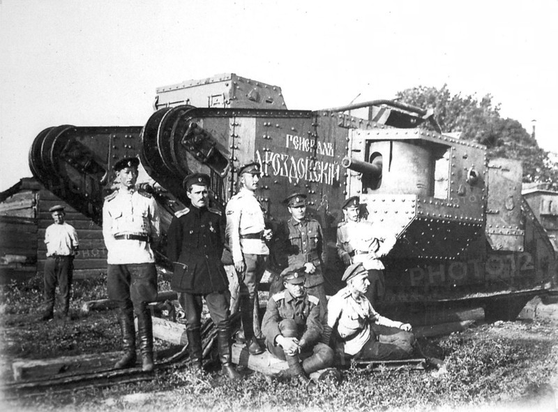 Soldiers of the Volunteer Army before the tank 'General Drozdovsky, 1919.  Artist: Anon