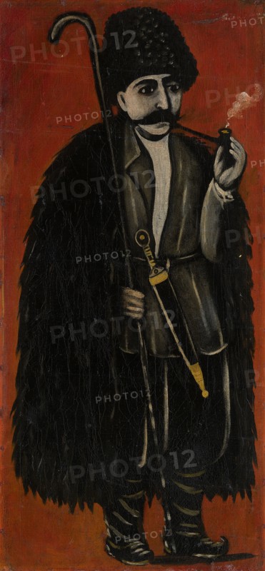 Shepherd in a Felt Cloak against a Red Background. Artist: Pirosmani, Niko (1862-1918)