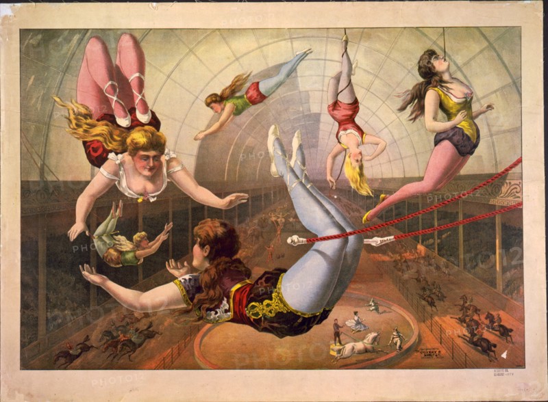 Female acrobats on trapezes at circus, c. 1890. Artist: Calvert Litho. Co.