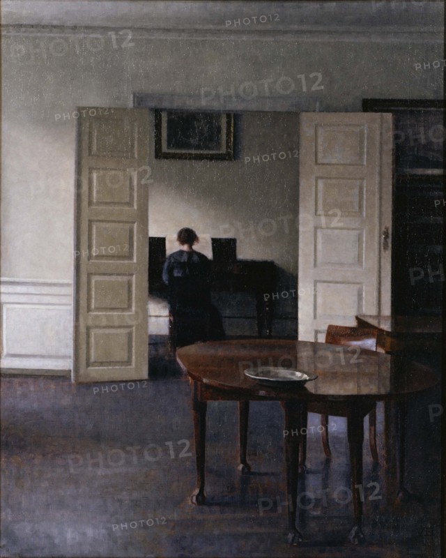 Interior with Ida Playing the Piano. Artist: Hammershøi, Vilhelm (1864-1916)