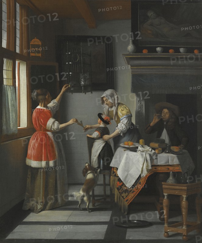 Interior with a Child Feeding a Parrot.