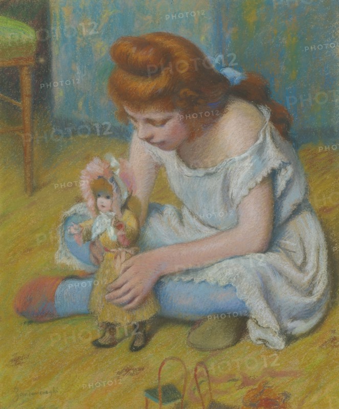 Yung girl playing with a doll.