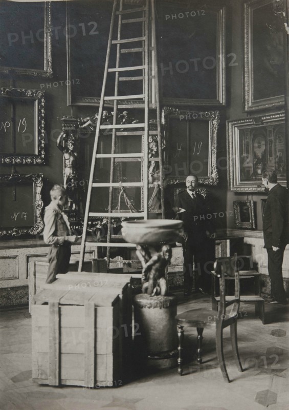 Preparing paintings for evacuation from one of the Italian halls at the Hermitage, 1917.
