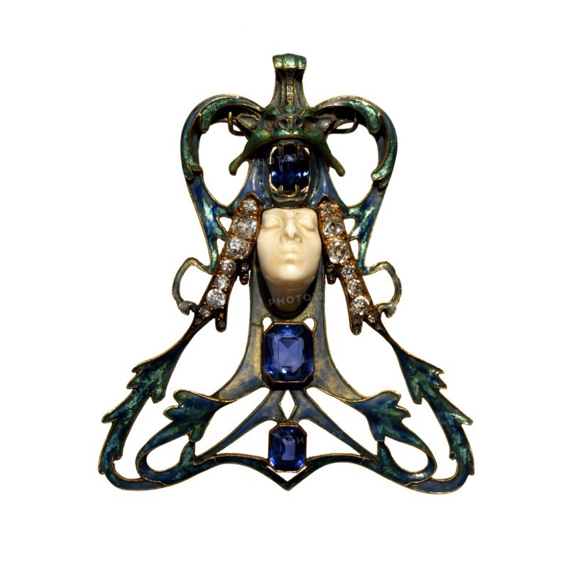 Female Face Pendant, 1897-1898.