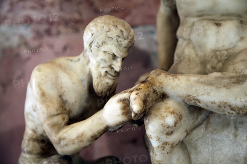 Pan and satyr, Pan removing a splinter from a satyr's foot. Artist: Unknown