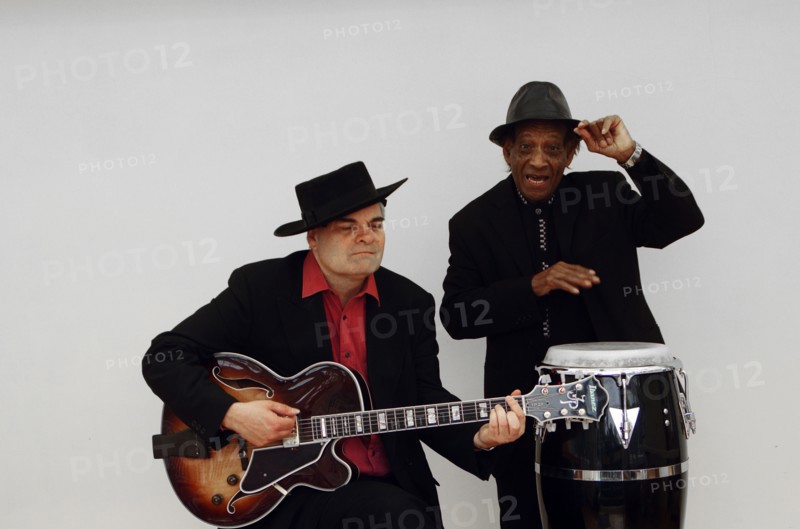 Frank Holder, Guyanan jazz singer and percussionist with Shane Hill, guitarist.   Artist: Brian O'Connor
