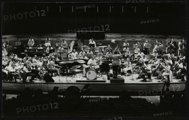 Buddy Rich and the Royal Philharmonic Orchestra in concert at the Royal Festival Hall, London, 1985. Artist: Denis Williams