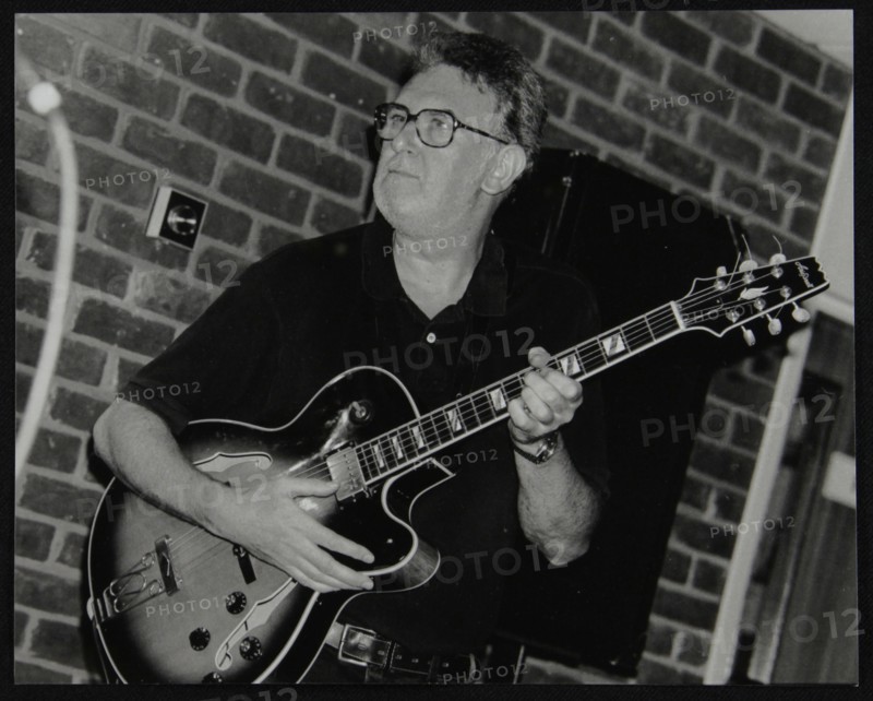 Jim Mullen playing guitar at The Fairway, Welwyn Garden City, Hertfordshire, 3 August 1997. Artist: Denis Williams