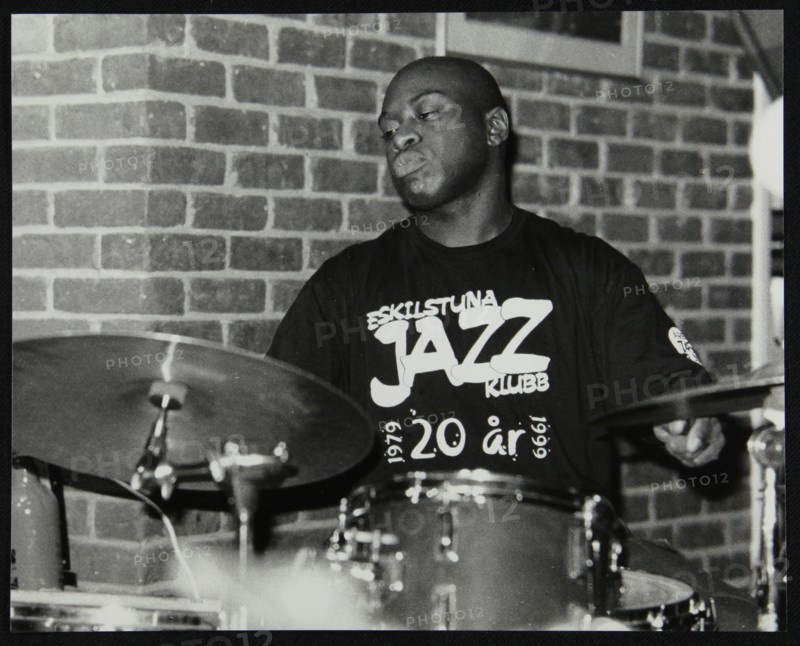 Winston Clifford on drums at The Fairway, Welwyn Garden City, Hertfordshire, 18 February 2001. Artist: Denis Williams