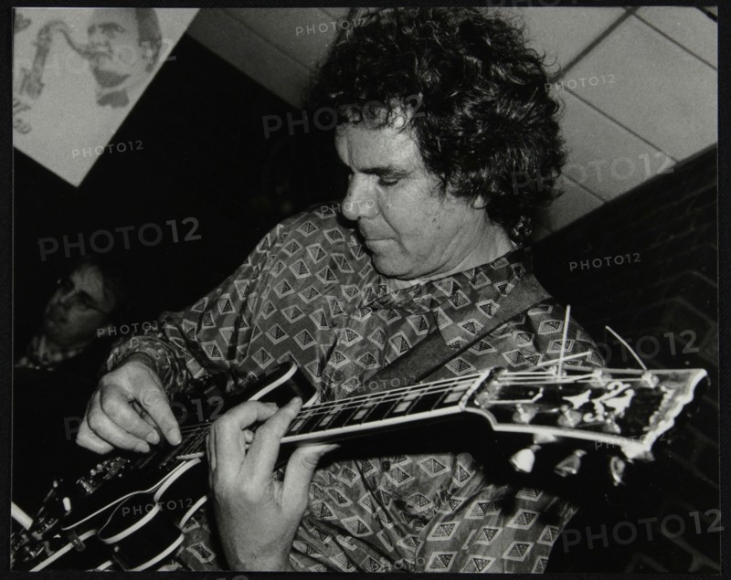 Guitarist John Etheridge playing at The Fairway, Welwyn Garden City, Hertfordshire, 9 November 2003. Artist: Denis Williams