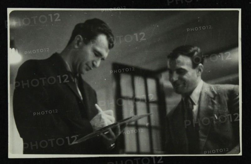 Dave Brubeck signing an autograph, c1950s. Artist: Denis Williams
