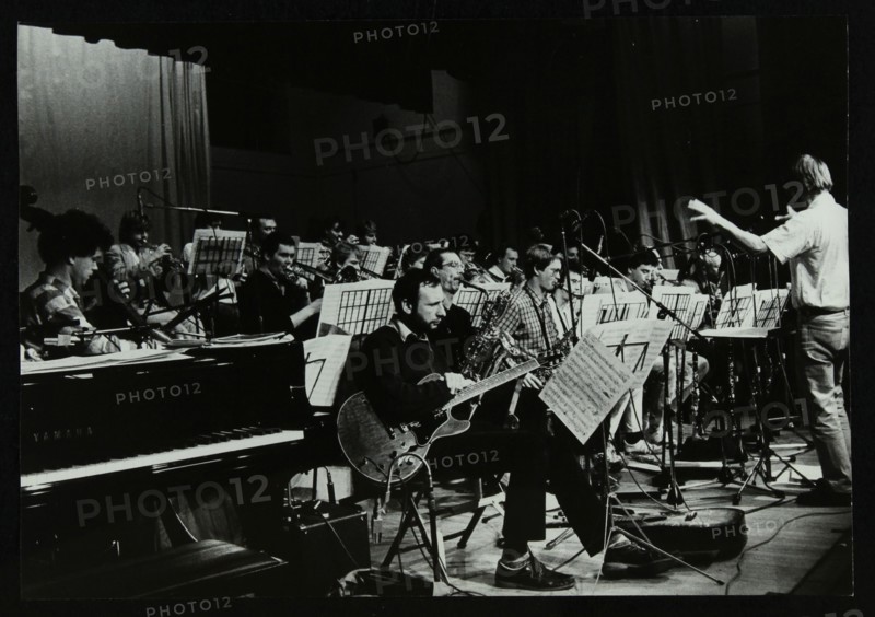 Michael Garrick conducting an orchestra at Berkhamsted Civic Centre, 1985. Artist: Denis Williams