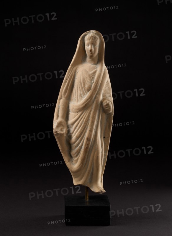 Terracotta statuette of a pious Roman veiling his head with his toga, 1st century. Artist: Unknown.