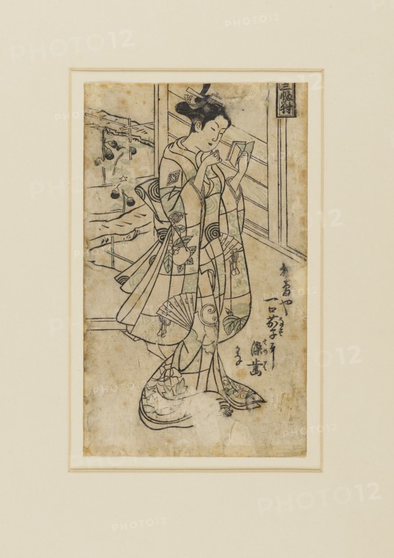 Woodblock print - Onoe Kikingoro I as a woman reading a book, 18th century Artist: Okumura Masanobu.