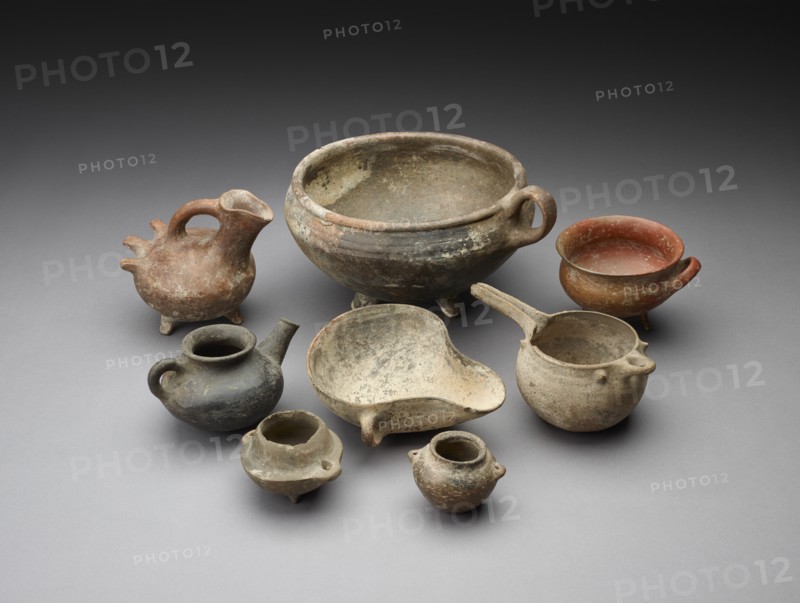 Small open mouth vessel with extended ledge and 2 handles around the body. Artist: Unknown.