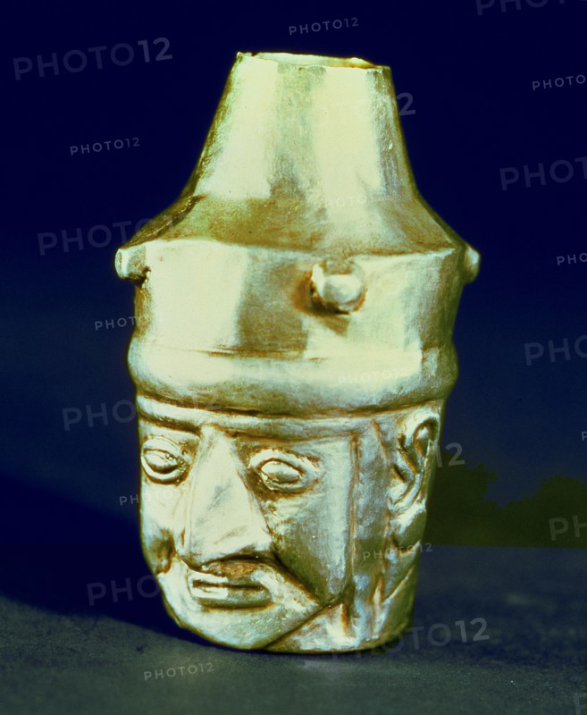 Anthropomorphic head shaped vase, made of silver and representing a hook-nosed person.