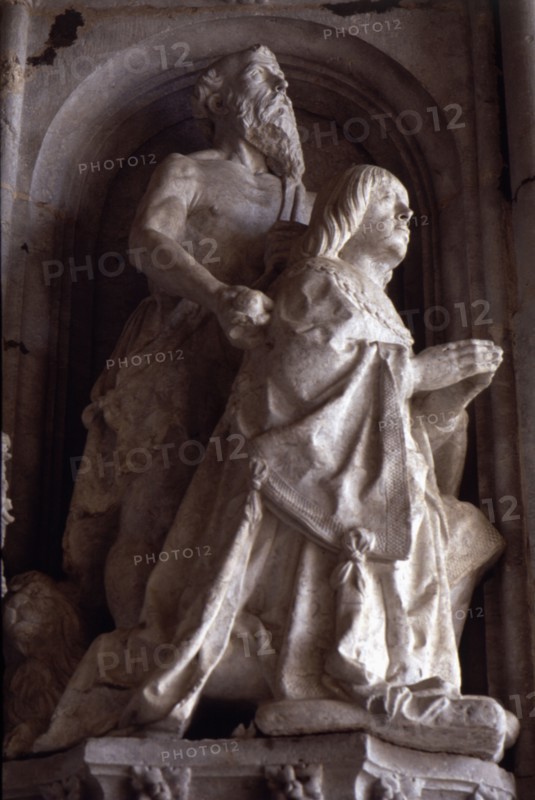 Praying statue of Don Manuel in the façade of the Jeronimos Monastery in Lisbon.