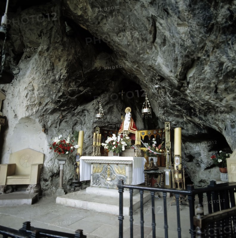 Interior of the Holy Cave of Covadonga with the image of the Virgin.