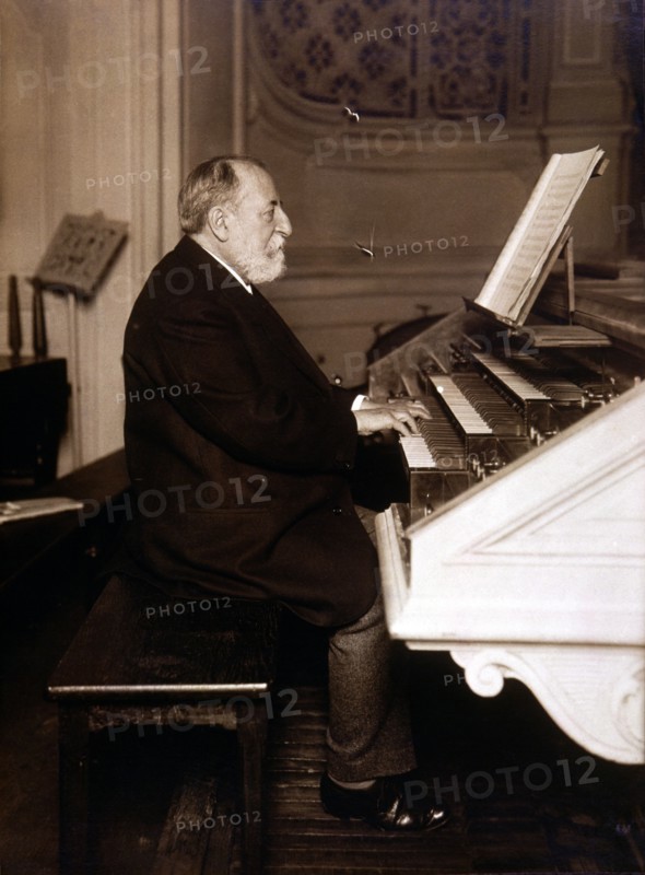 Camille Saint-Saens (1835 - 1921), French composer, photography playing the organ.
