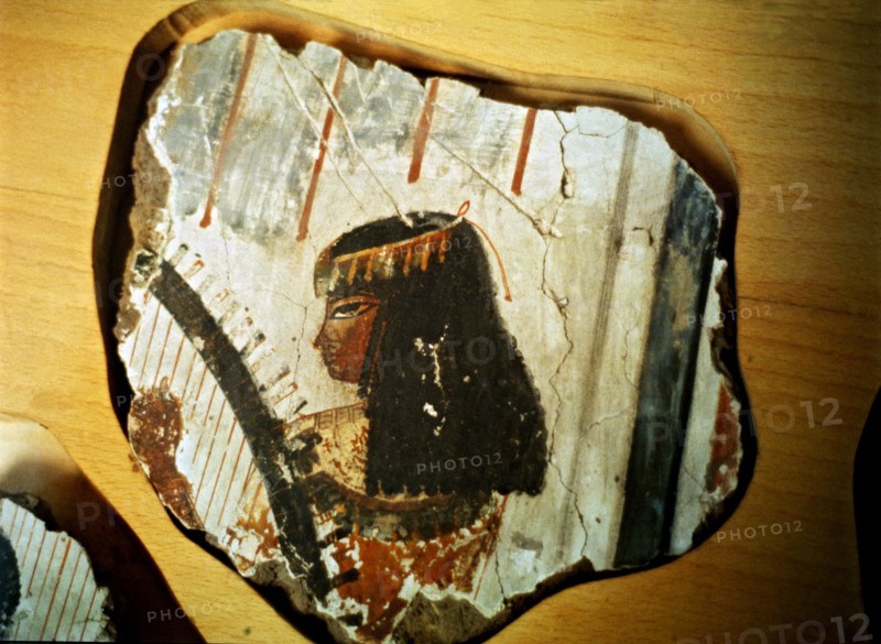 Fragment of a fresco from Thebes, showing a woman playing the harp.