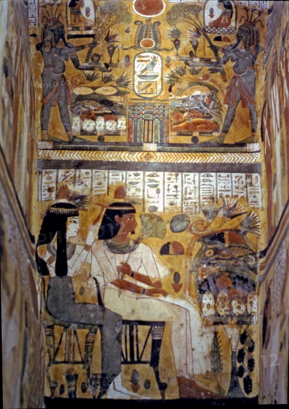Frescoes inside a sarcophagus in wood.