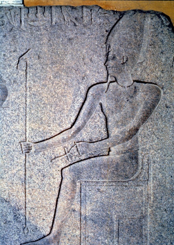 Detail of a stone engraving depicting a priest.