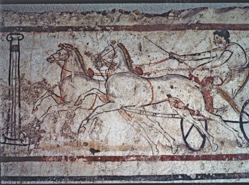 Fresco from a Lucan tomb in Paestum depicting a man in a carriage drawn by two horses.