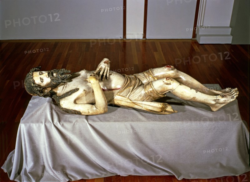 Christ lying in a St. Sepulchre, made in 1350 in alabaster, preserved in the church of Sant Feliu?