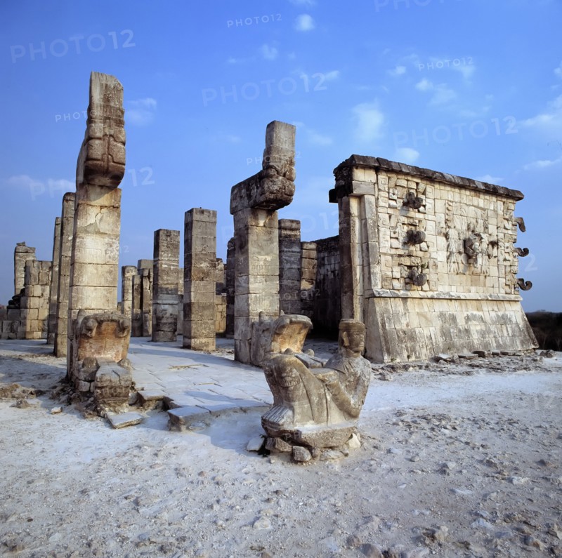 Chichen Itza, view of Temple of the Warriors, with a sculpture in foreground.