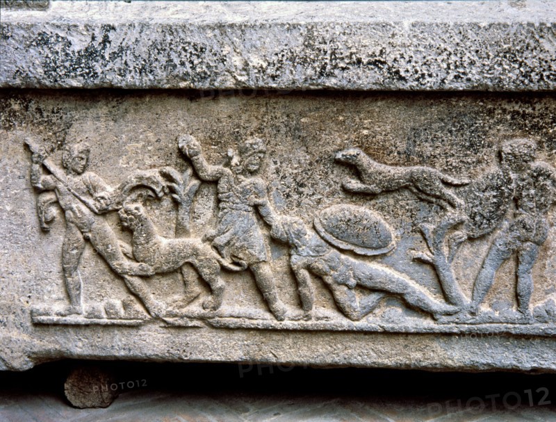 Etruscan stone sarcophagus with reliefs of Eastern influence, with scenes of hunting and battle.