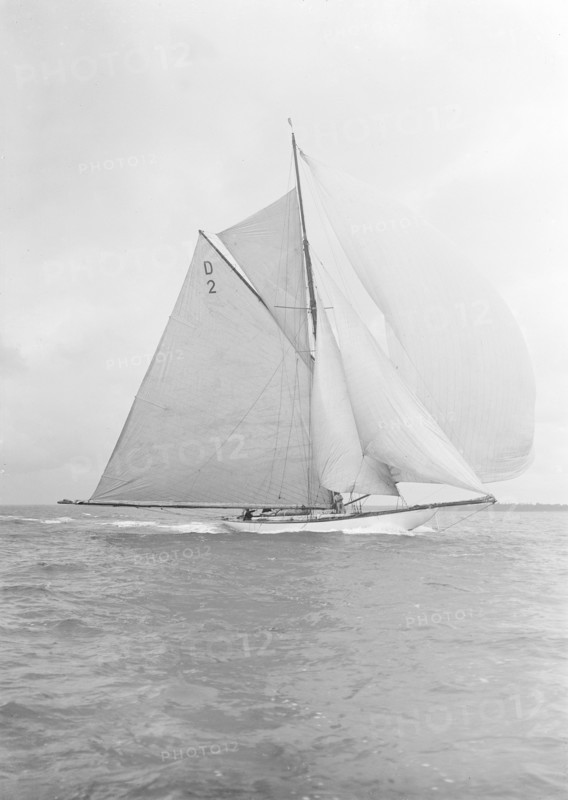 The 15 Metre cutter 'Ostara' broad reaching, 1912. Creator: Kirk & Sons of Cowes.