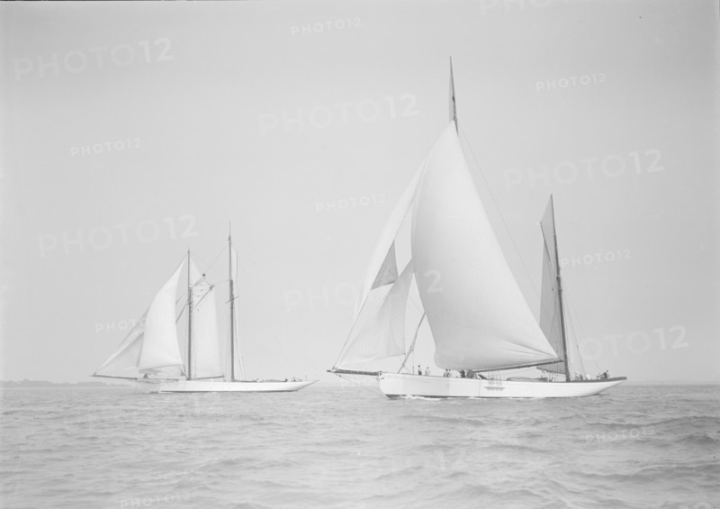 The ketch 'Cariad' and schooner 'Irma' racing downwind, 1911. Creator: Kirk & Sons of Cowes.