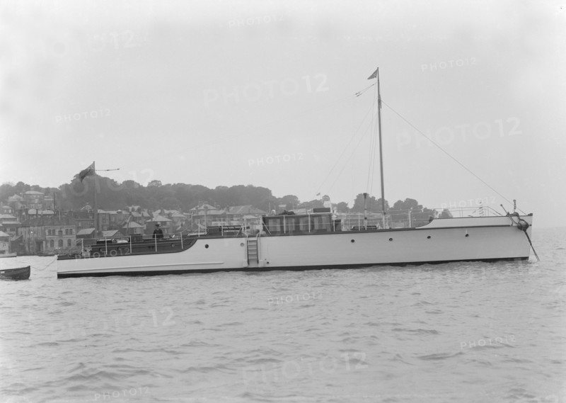 The 12 ton motor yacht 'Cordon Rouge' at anchor, 1923. Creator: Kirk & Sons of Cowes.