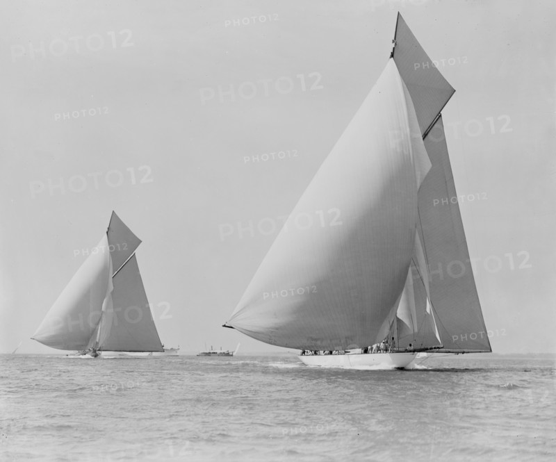 The sailing yachts 'White Heather' and 'Shamrock', race downwind. Creator: Kirk & Sons of Cowes.