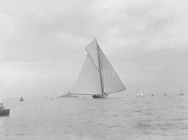 The racing cutter 'Terpisichore' running downwind, 1922. Creator: Kirk & Sons of Cowes.