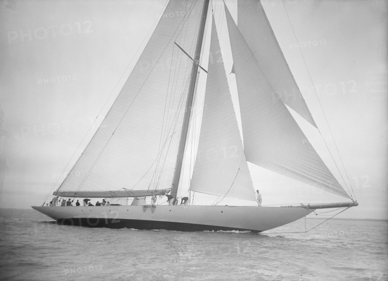 The 23-metre cutter 'Astra' sailing close-hauled, 1935. Creator: Kirk & Sons of Cowes.