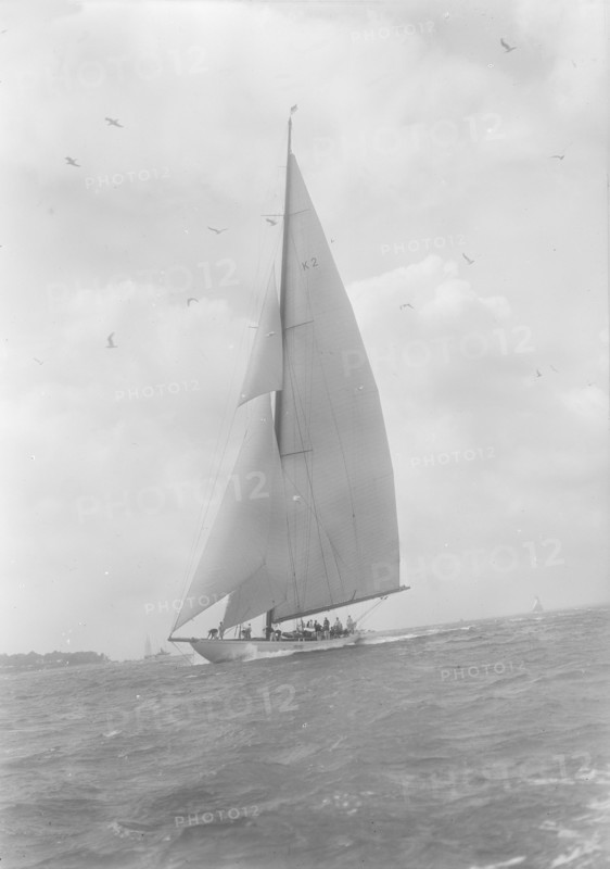 The 23-metre cutter 'Astra' sailing close-hauled, 1933. Creator: Kirk & Sons of Cowes.