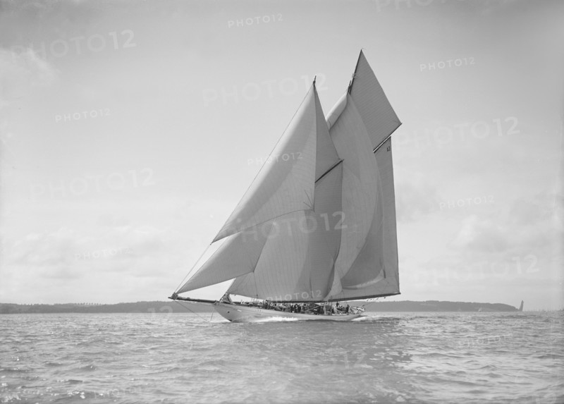 The 250 ton schooner 'Germania' sails close reach, 1911. Creator: Kirk & Sons of Cowes.