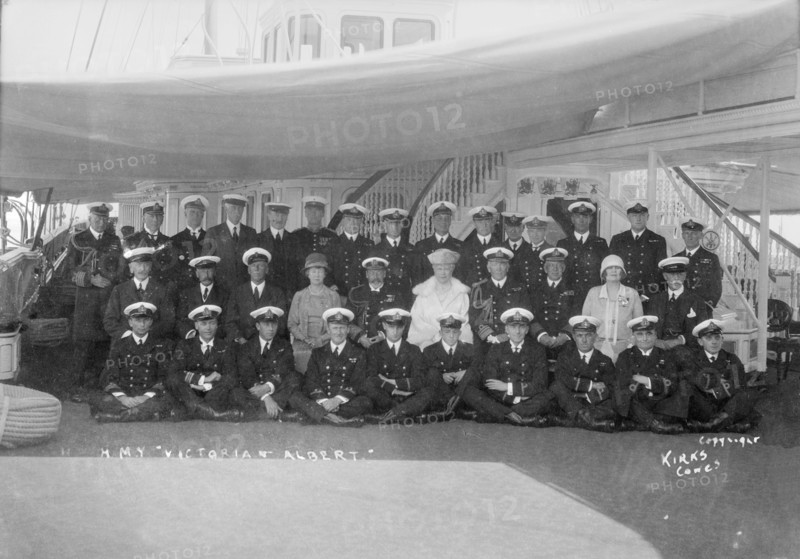 King George V and Queen Mary aboard 'HMY Victoria and Albert', with her crew, c1933. Creator: Kirk & Sons of Cowes.