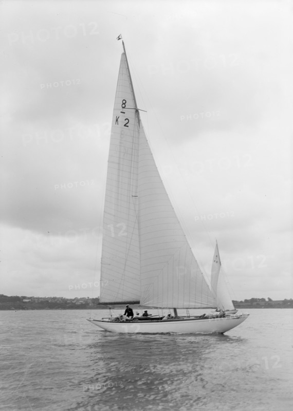 The 8 Metre Carron (K2) sailing upwind, 1934. Creator: Kirk & Sons of Cowes.