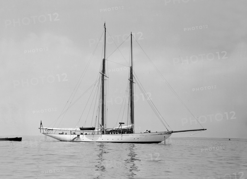 The schooner 'Joyance' at anchor, 1913. Creator: Kirk & Sons of Cowes.