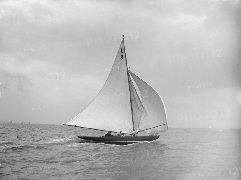 'Scotia IV' running downwind with spinnaker, 1913. Creator: Kirk & Sons of Cowes.