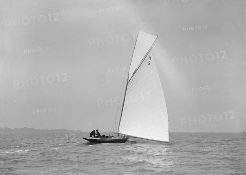'Termagent' (H9), an early 8 Metre class yacht sails downwind, 1911. Creator: Kirk & Sons of Cowes.