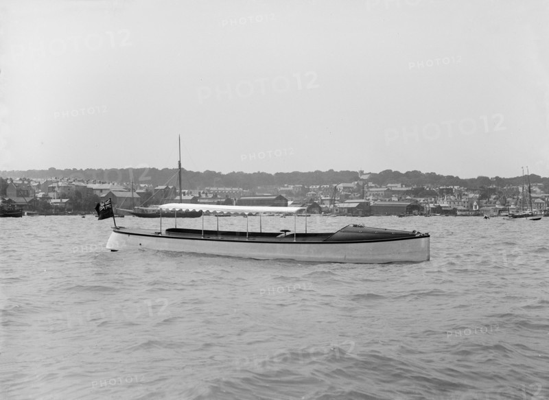 Saunders' motor launch at anchor, 1914. Creator: Kirk & Sons of Cowes.