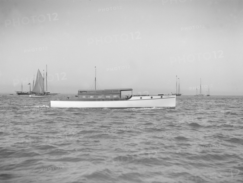 The motor launch 'Cygnet' under way, 1912. Creator: Kirk & Sons of Cowes.
