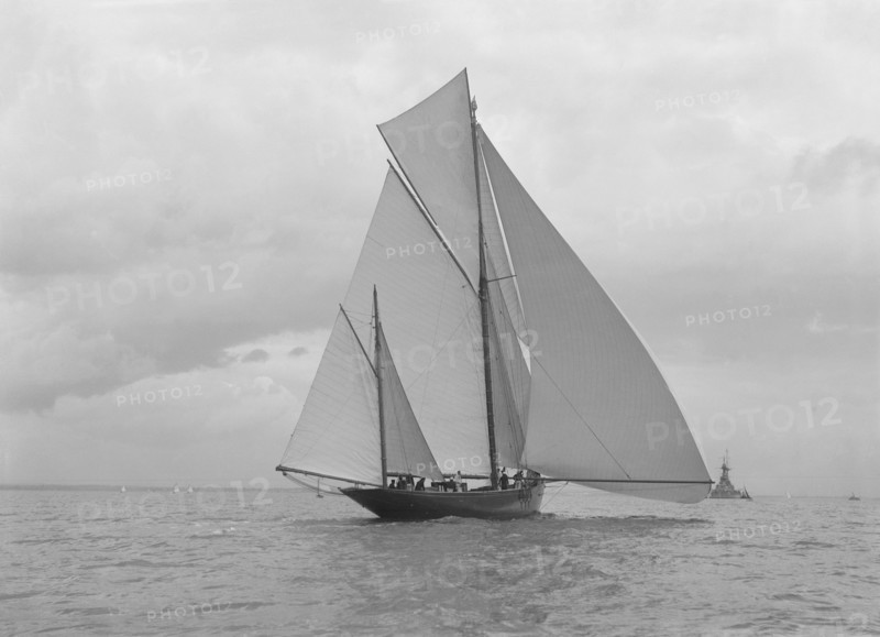 The yawl 'Harbinger' running downwind, 1922. Creator: Kirk & Sons of Cowes.