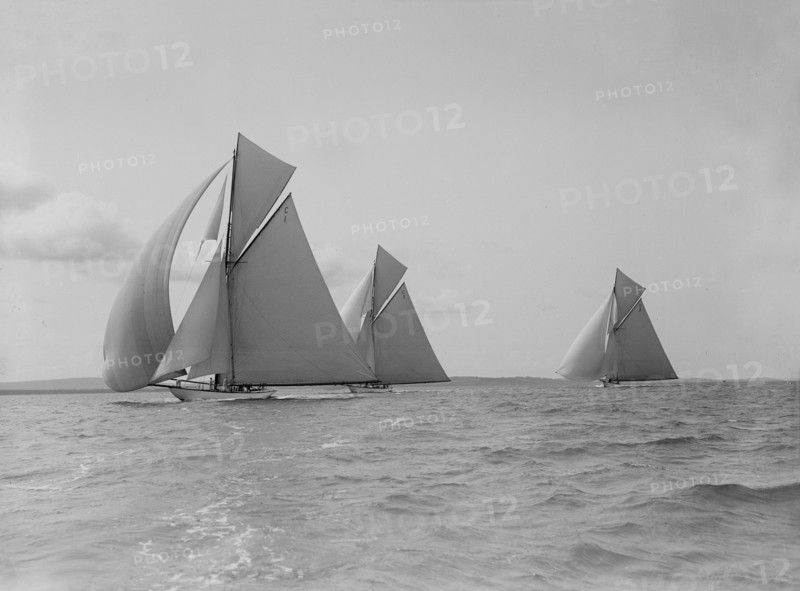 The 19-metre 'Maraquita', 'Corona' & 'Octavia' racing downwind, 1912. Creator: Kirk & Sons of Cowes.